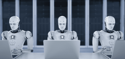 AI robots at desk on computers